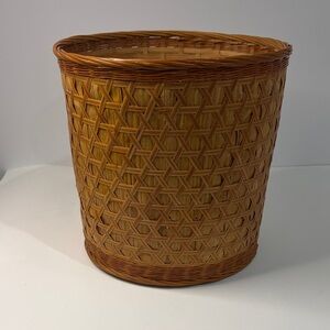 Vintage wicker planter, garbage can or basket for items.